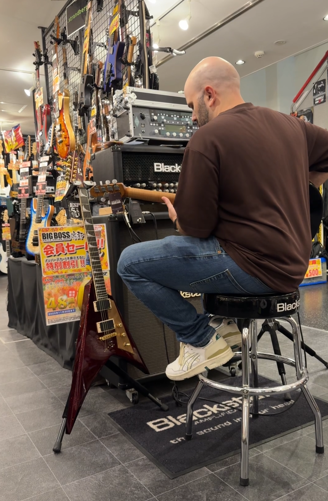 Playing guitar at a store in Japan
